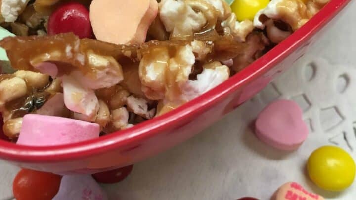 Homemade Salted Caramel Popcorn is a great snack for football parties, Valentine's Day gifts, teacher gifts, and just plain ole' good snacks.