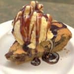 Create a giant chocolate cookie in a cast iron skillet is so easy to make. Mix the ingredients and scoop them into the skillet, and you'll have a delicious treat in no time.