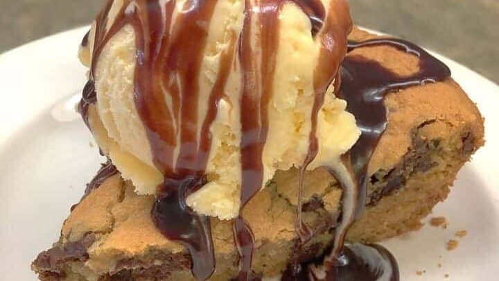 Create a giant chocolate cookie in a cast iron skillet is so easy to make. Mix the ingredients and scoop them into the skillet, and you'll have a delicious treat in no time.