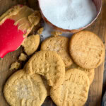 Peanut butter cookies on a cutting board.