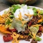 Easy Dorito Taco Salad Recipe is a cinch to make. It features spicy taco flavors that will please a crowd. Easy Dorito Taco Salad is perfect for a family supper, a tailgating party, football games, or any holiday. #dorito #taco #salad #supper #dinner