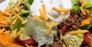 Easy Dorito Taco Salad Recipe is a cinch to make. It features spicy taco flavors that will please a crowd. Easy Dorito Taco Salad is perfect for a family supper, a tailgating party, football games, or any holiday. #dorito #taco #salad #supper #dinner