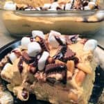 Reese's Peanut Butter Pudding Dessert is the perfect recipe for any gathering. The peanut butter cup dessert is filled with pudding, marshmallows, peanuts, graham crackers, and chocolate syrup. The recipe is a delicious treat that everyone will love.