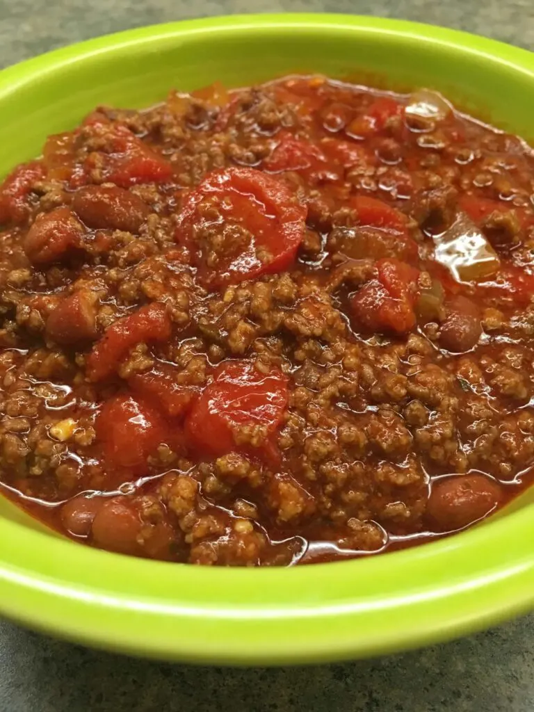 Homemade easy chili in a green bowl. 