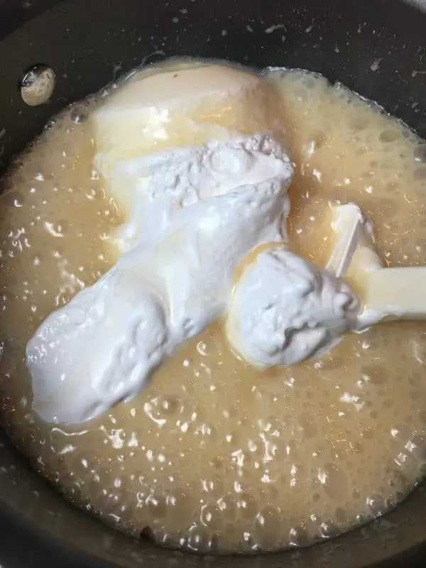 Easy peanut butter fudge marshmallow creme in a saucepan.