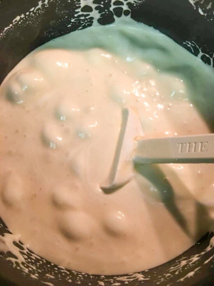 Melting marshmallow cream in a saucepan.