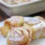 Picture of cinnamon rolls with icing on a plate.