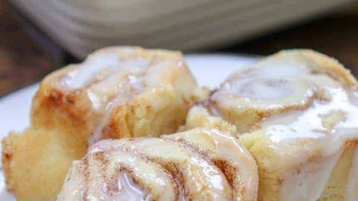 Picture of cinnamon rolls with icing on a plate.