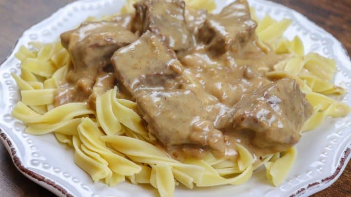 Picture of beef and noodles on a white plate