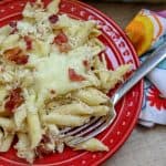 Picture of penne pasta on a red plate