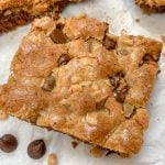 Picture of a cookie bar on top of parchment paper.