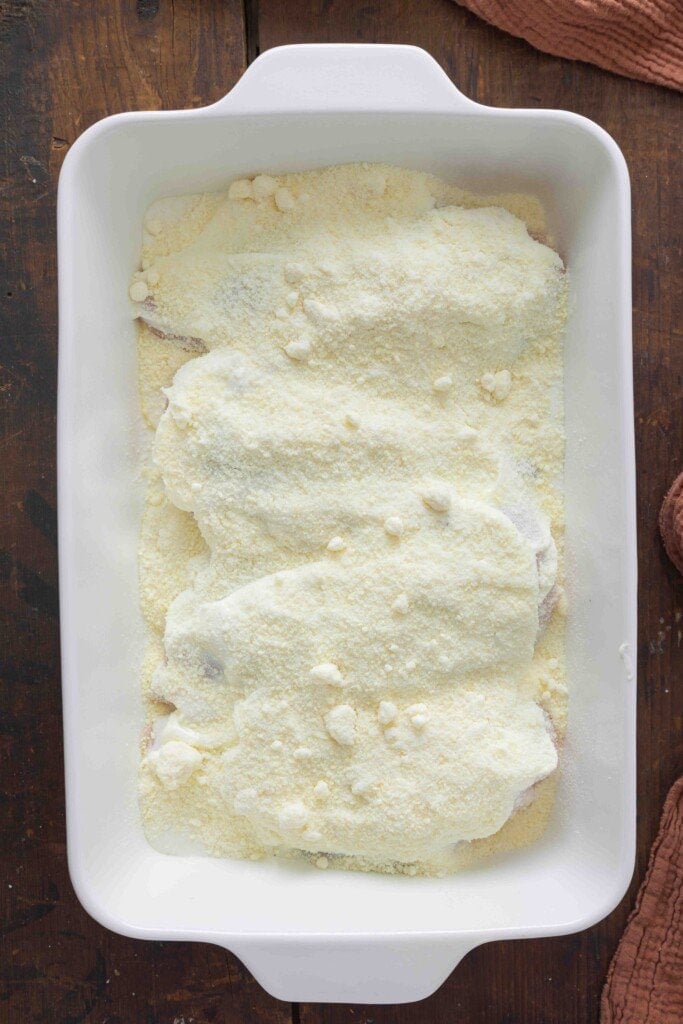 Chicken breasts with parmesan cheese on top.