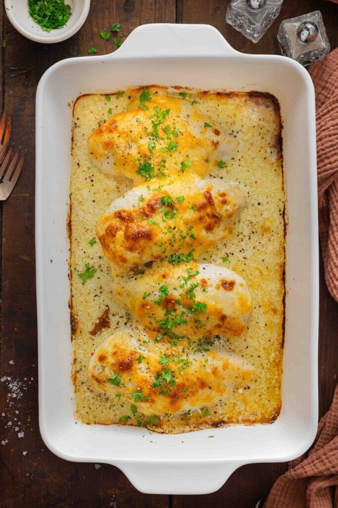 Baked chicken breast recipe in a casserole dish.