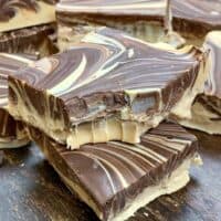 Several pieces of tiger butter fudge sitting in a pile