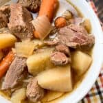 Slow cooker beef stew in a white bowl