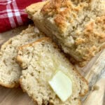 Sliced homemade beer bread with melting butter