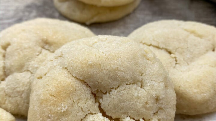 Soft and chewy sugar cookies on a counter.
