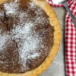 chocolate chess pie with powered sugar on top