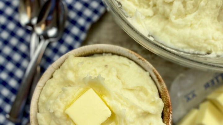Mashed potatoes in a bowl with butter.