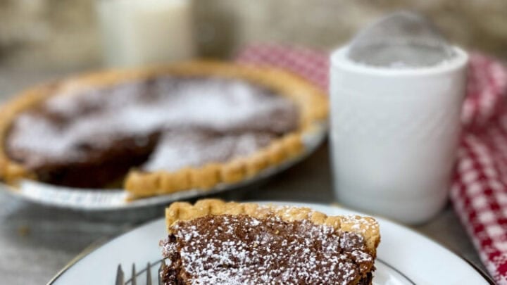 Chocolate chess pie on a plate.