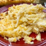 Hasbrown casserole on a red plate.