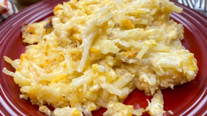 Hasbrown casserole on a red plate.