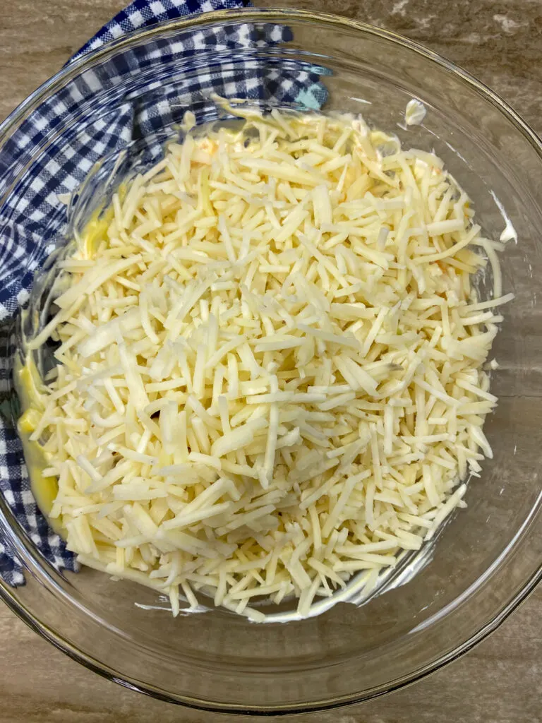 Hashbrowns in a large glass bowl.