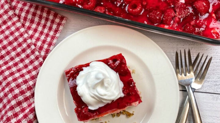 Raspberry Jello Salad on a white plate.