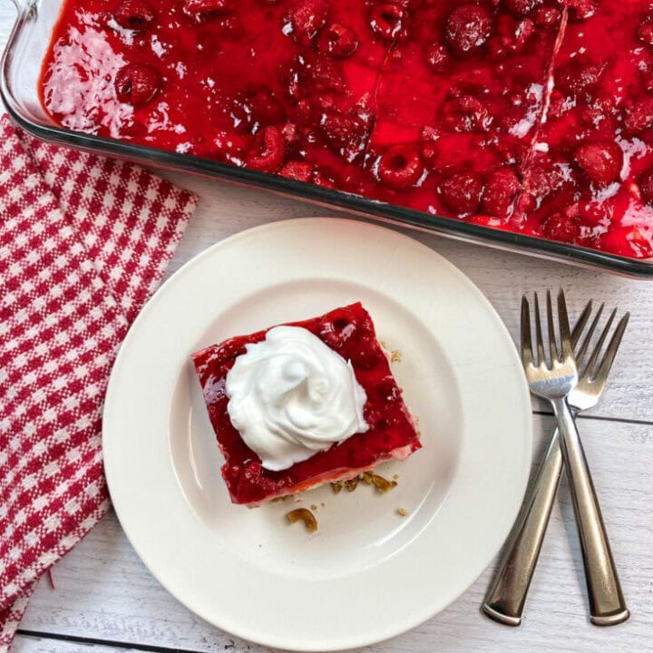Raspberry Jello Salad on a white plate.