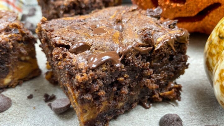 Cream cheese pumpkin swirl brownies on the counter.