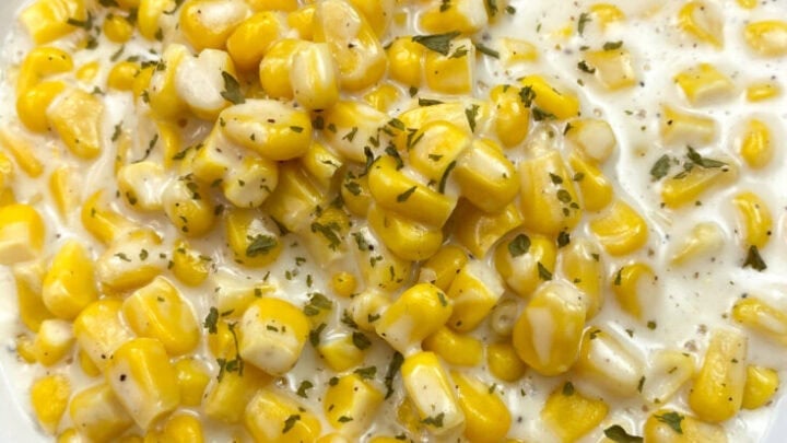Creamed corn in a white bowl.