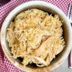Slow cooker taco chicken recipe in a bowl.