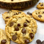 Peanut butter chocolate chip cookies on parchment paper.