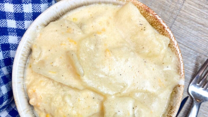 Cheesy au gratin potatoes in a bowl.