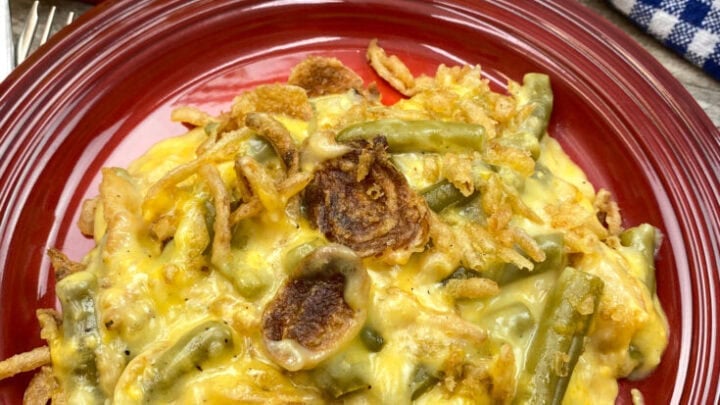 Cheesy green bean casserole on a plate.