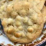 Homemade cookies on a brown and white plate.