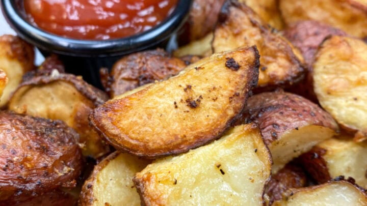 Oven roasted red potatoes on a plate.