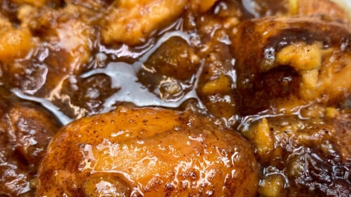 Baked candied yams on a white plate.