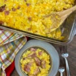 Ham and potato bake with cheese in a bowl and casserole dish.
