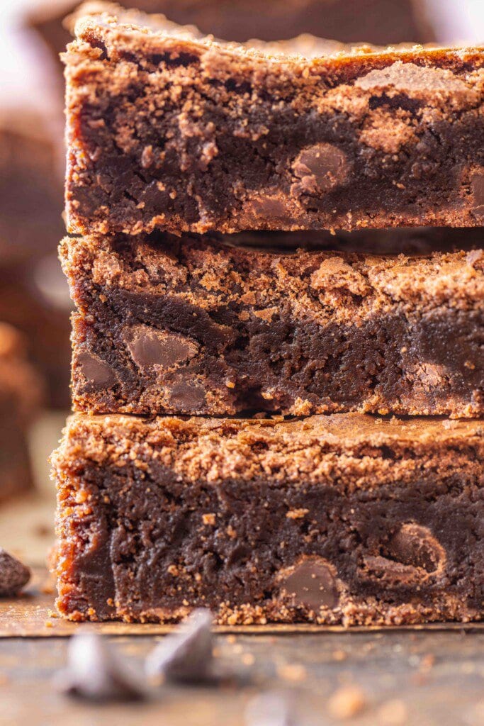 Stacked brownies on a counter. 