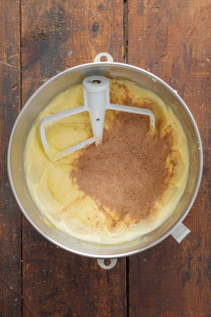 Adding sifted flour to a bowl. 