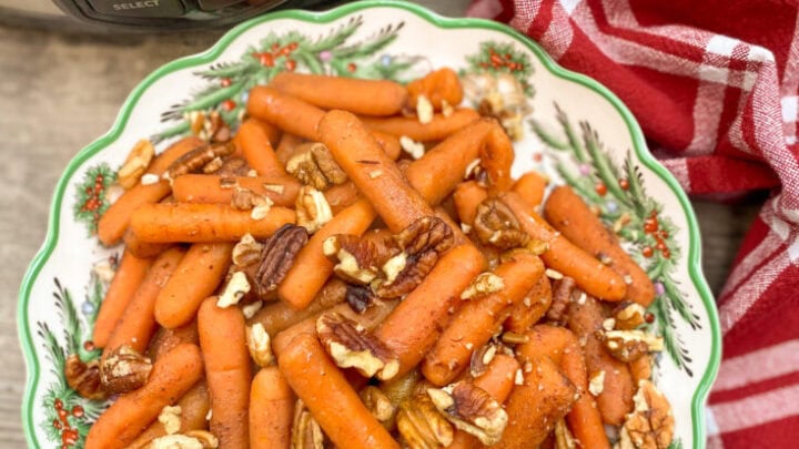 Cooked carrots in a Christmas bowl.