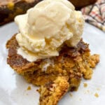 Pumpkin dump cake on a white plate.
