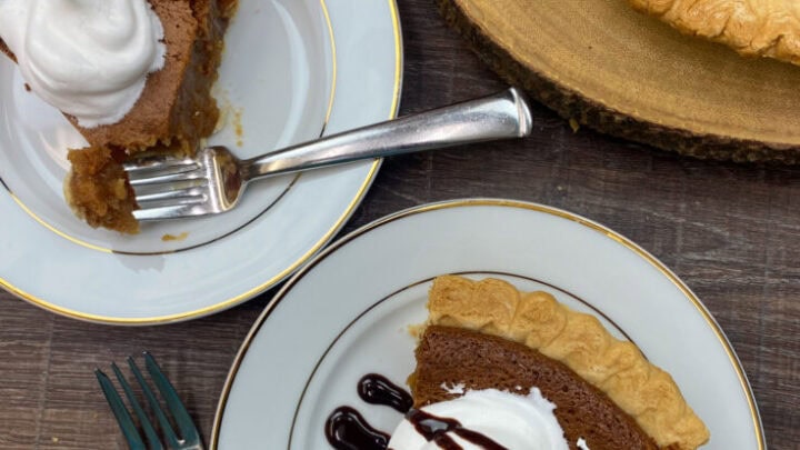 Peanut butter pie with chocolate drizzled on top.