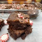Peppermint brownies stacked on top of each other.