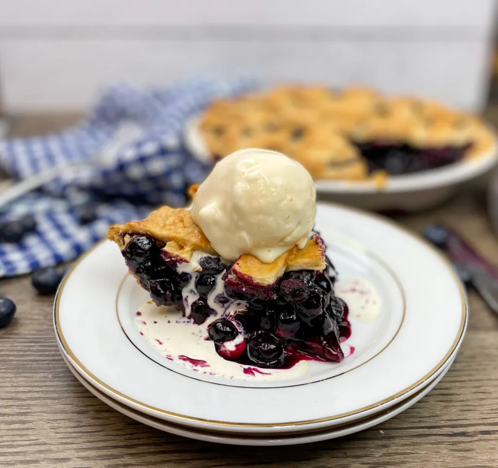 A scoop of ice cream on top of pie