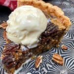 Maple pecan pie with ice cream on a cookie sheet.
