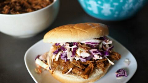 Instant pot barbecue chicken on a bun with coleslaw.
