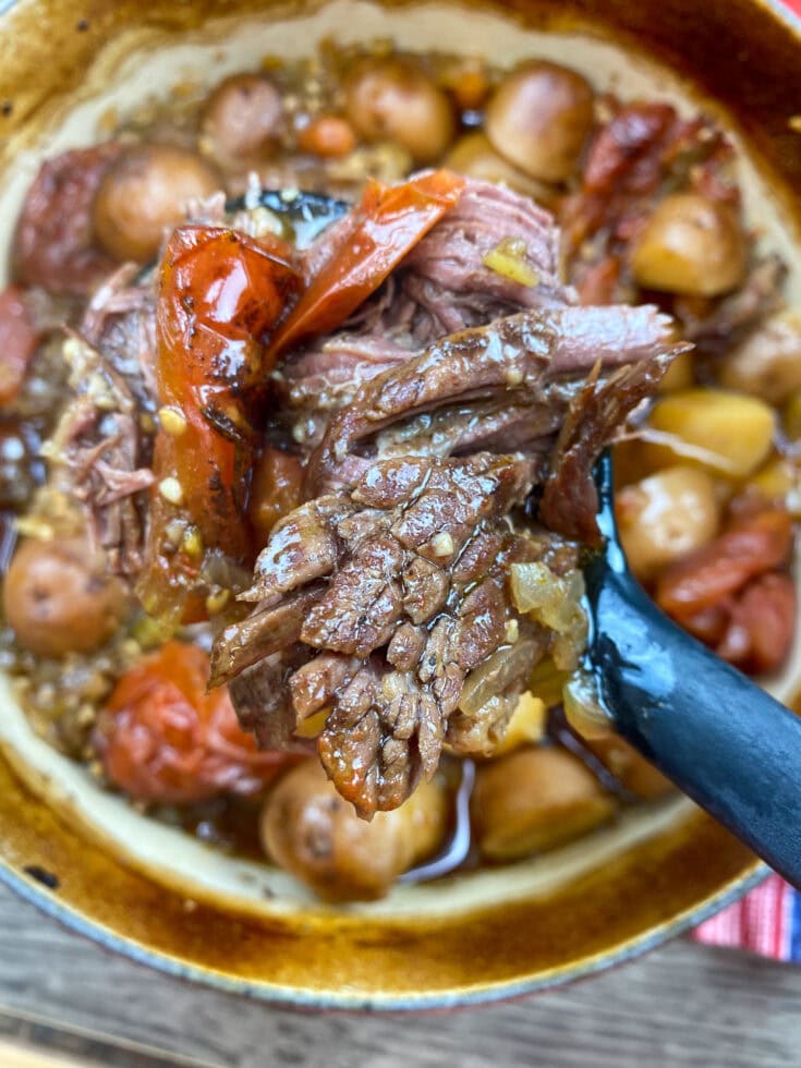 Cooked pot roast in a dutch oven