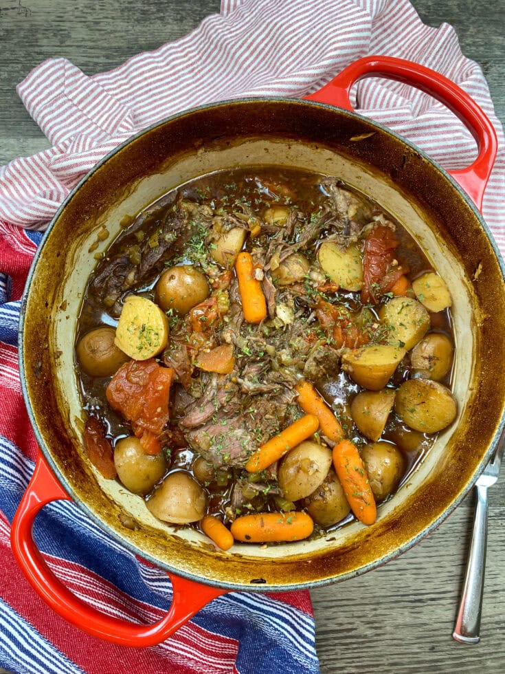 Chuck roast in a red dutch oven